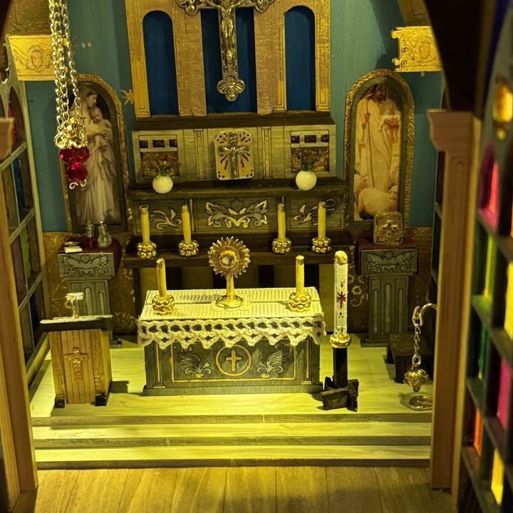 Interior of a handmade model church, lit from within